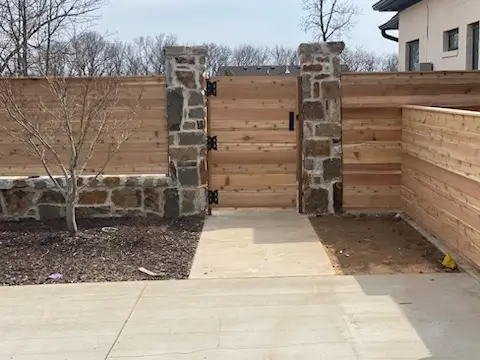 Horizontal wooden fence with stone accents