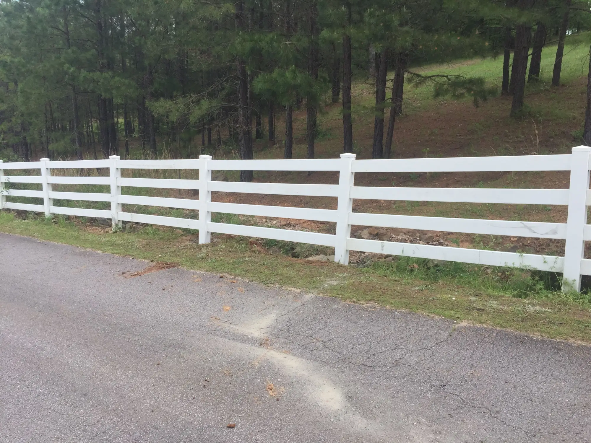 White vinyl fencing around property